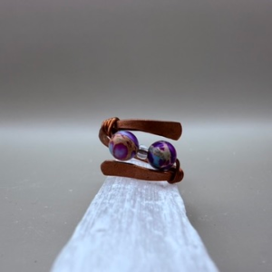Handmade Copper Ring with Colorful Imperial Jasper beads sitting on Selenite tower.